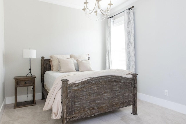 carpeted bedroom featuring a chandelier and baseboards