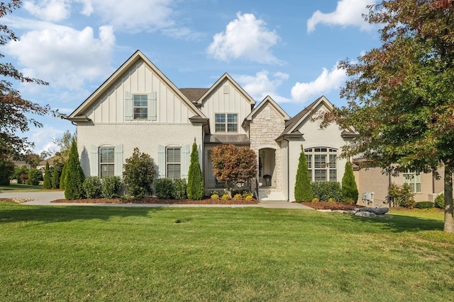 view of front of property with board and batten siding and a front yard