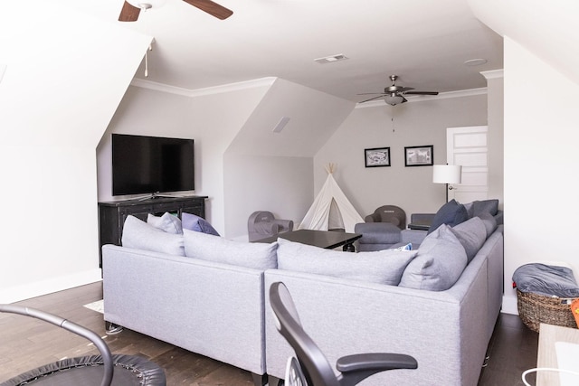 living area with ornamental molding, dark wood finished floors, visible vents, and a ceiling fan