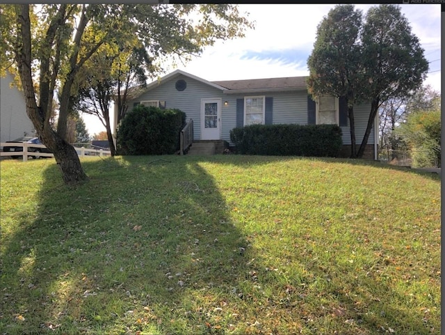 single story home with a front yard