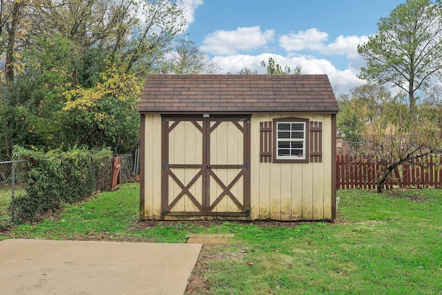 view of shed with fence