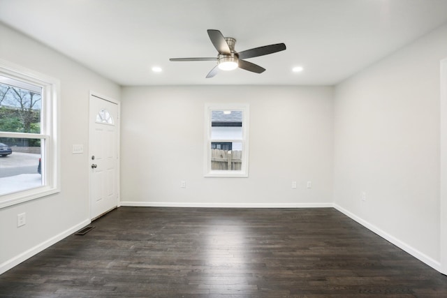 interior space featuring a ceiling fan, baseboards, wood finished floors, and recessed lighting