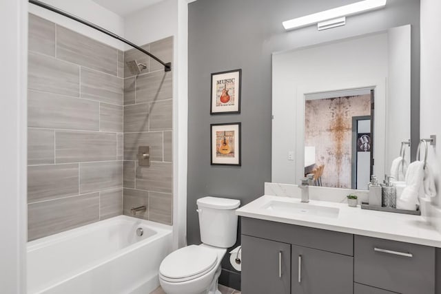 bathroom featuring shower / bath combination, toilet, and vanity