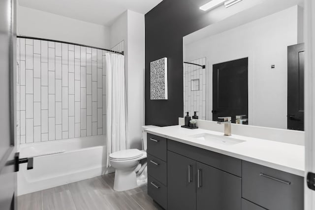 bathroom with vanity, toilet, and shower / bathtub combination with curtain