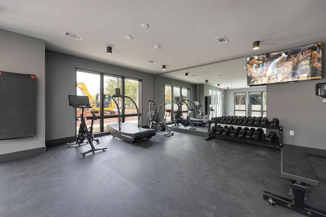 exercise room featuring baseboards and visible vents