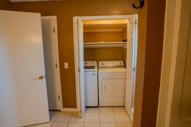 laundry area with laundry area, light tile patterned floors, and separate washer and dryer