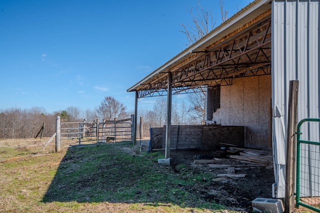 view of yard featuring an outbuilding and an exterior structure