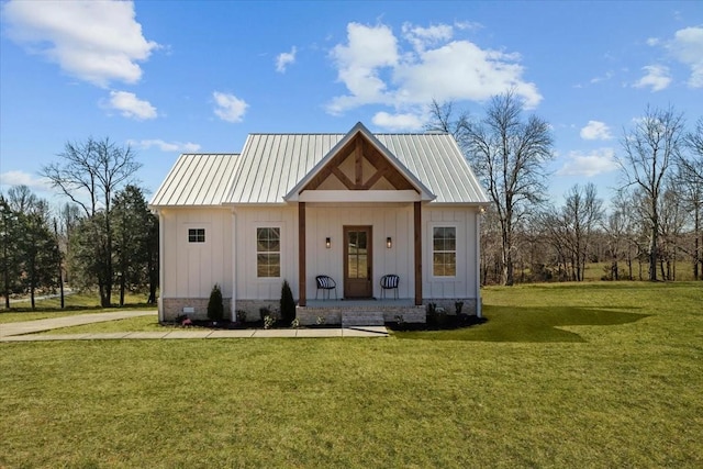 modern inspired farmhouse with crawl space, metal roof, board and batten siding, and a front yard