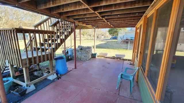 view of patio / terrace with fence, stairway, and a wooden deck