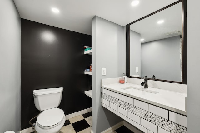 bathroom featuring toilet, recessed lighting, visible vents, baseboards, and tile patterned floors