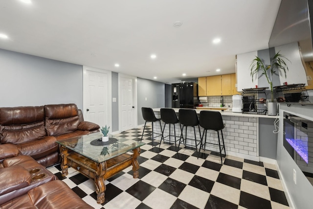 living room with recessed lighting and light floors