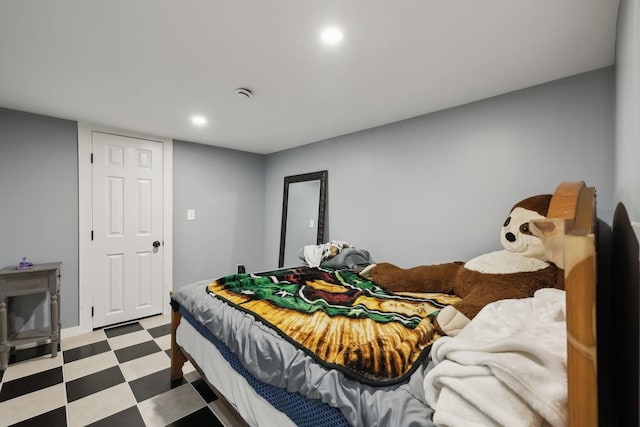 bedroom featuring light floors and recessed lighting