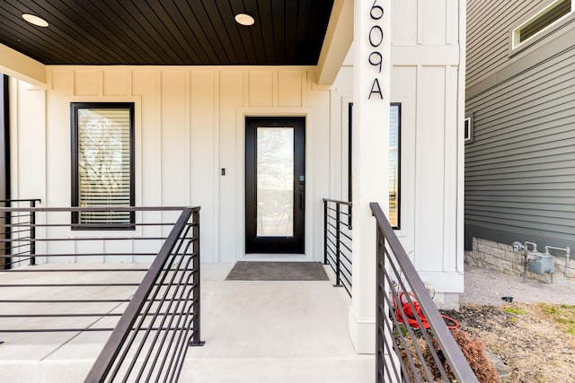 entrance to property featuring board and batten siding