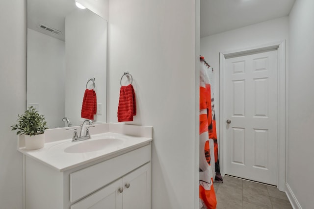 full bathroom featuring visible vents, a shower with curtain, vanity, and tile patterned floors