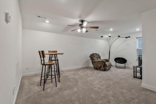 sitting room featuring baseboards, visible vents, carpet flooring, and recessed lighting