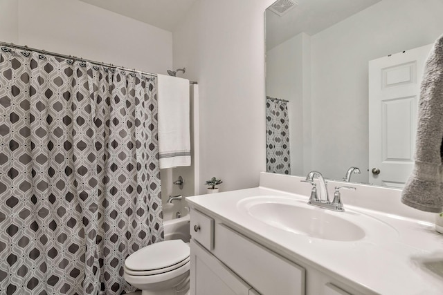 full bathroom with toilet, shower / tub combo, vanity, and visible vents