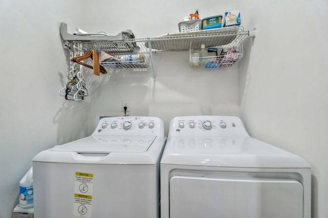 clothes washing area featuring laundry area and independent washer and dryer