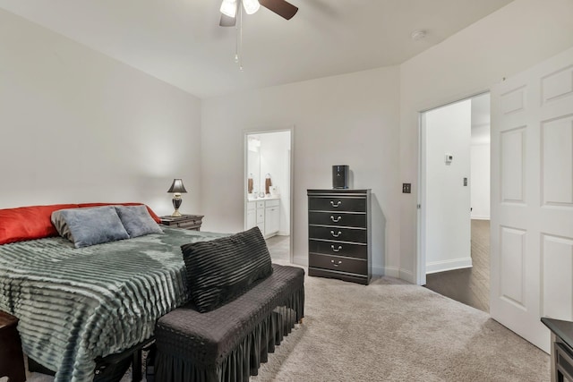 carpeted bedroom with ceiling fan and ensuite bathroom