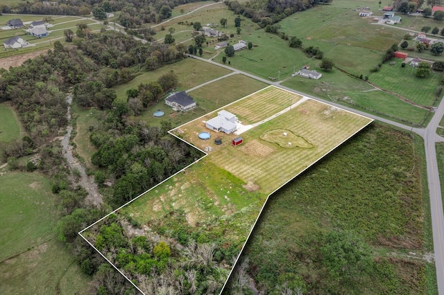 birds eye view of property featuring a rural view