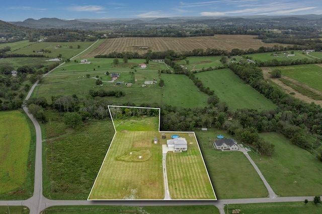 drone / aerial view featuring a rural view and a mountain view