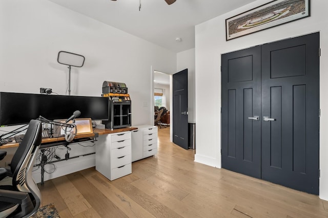 office area featuring ceiling fan and light wood-style floors