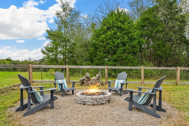 exterior space featuring fence and a fire pit