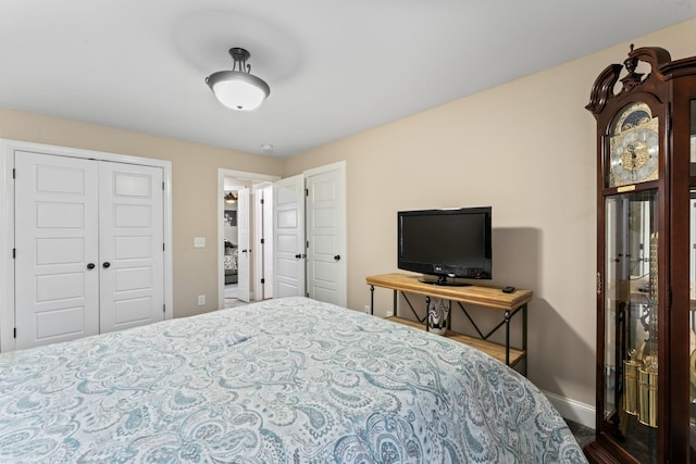 bedroom featuring a closet and baseboards