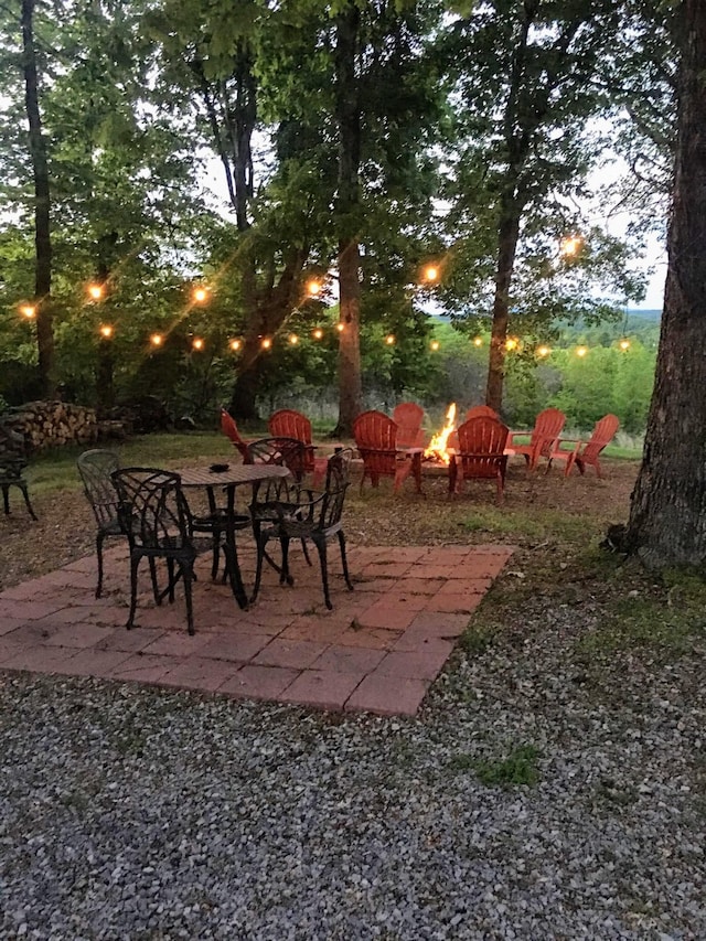 view of yard with a patio area and a fire pit