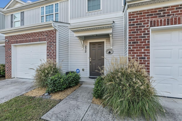 entrance to property featuring brick siding and board and batten siding