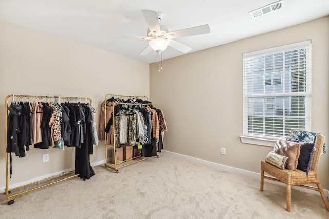 spacious closet with a ceiling fan, carpet, and visible vents