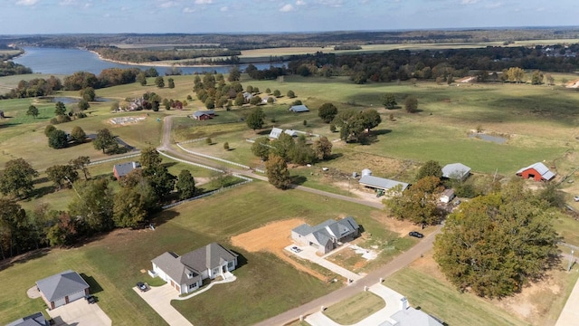 birds eye view of property with a water view and a rural view