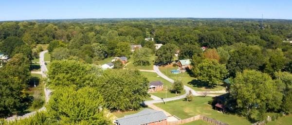 aerial view featuring a wooded view