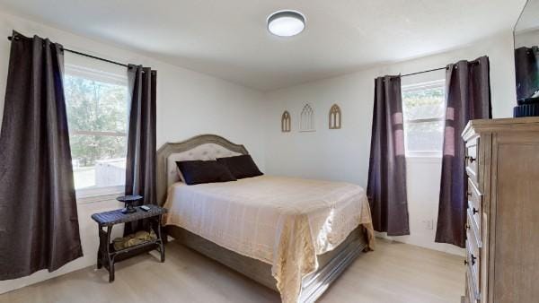 bedroom featuring light wood finished floors