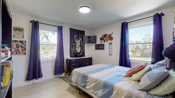 bedroom featuring light wood-style flooring