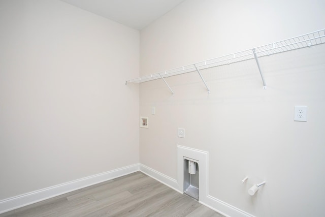 washroom with washer hookup, light wood-style floors, hookup for an electric dryer, laundry area, and baseboards