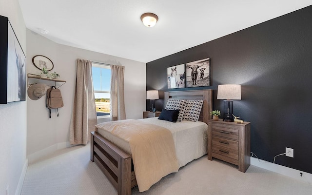 bedroom with carpet flooring and baseboards