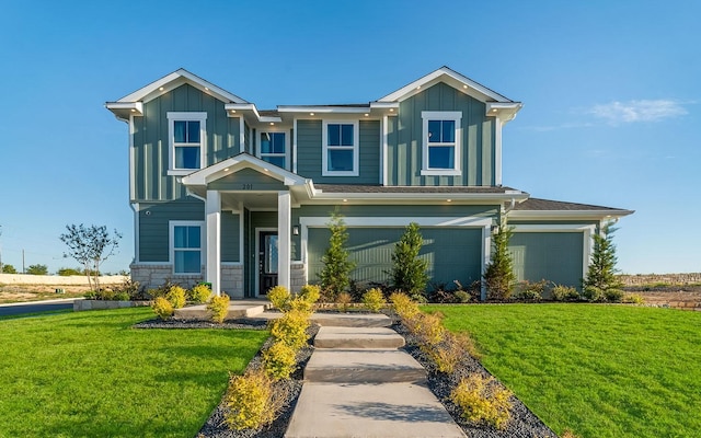 craftsman-style house featuring a garage, board and batten siding, and a front lawn