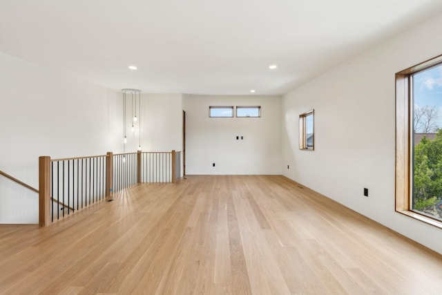 spare room with light wood finished floors and recessed lighting