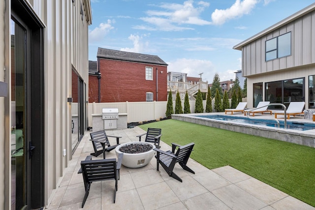 view of patio with an outdoor fire pit, grilling area, a fenced backyard, and a fenced in pool