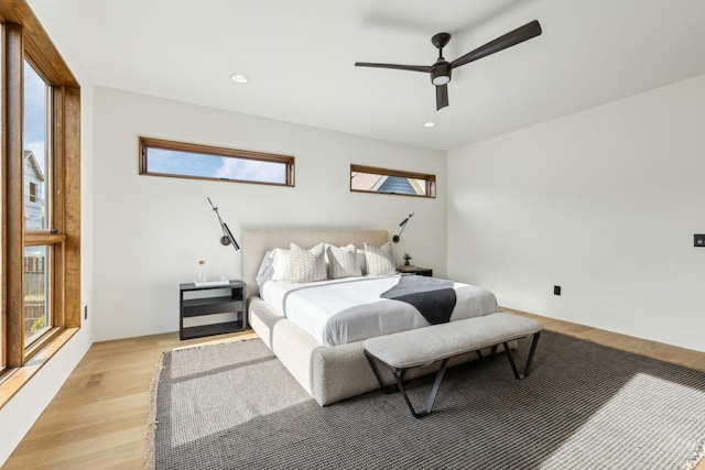 bedroom with ceiling fan, light wood finished floors, visible vents, and recessed lighting