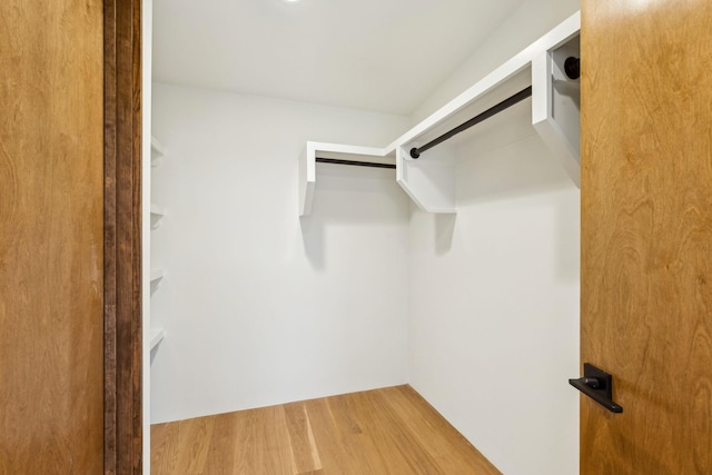 spacious closet with wood finished floors