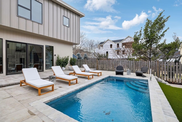 view of pool with a patio area, fence, and a fenced in pool