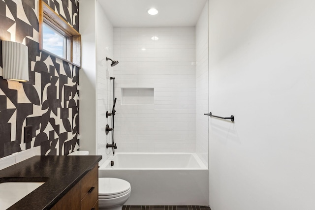 full bath featuring tub / shower combination, vanity, and toilet