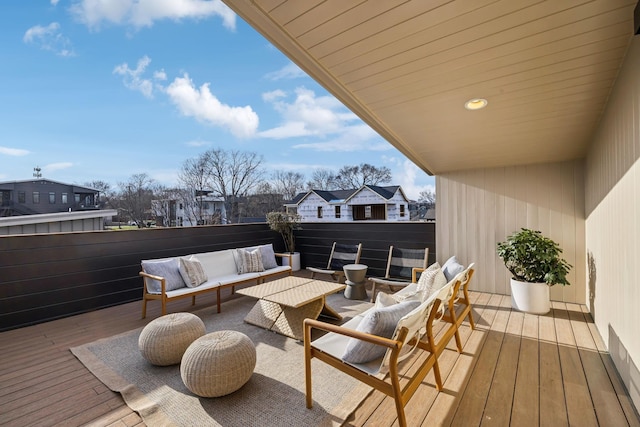 wooden deck featuring an outdoor living space