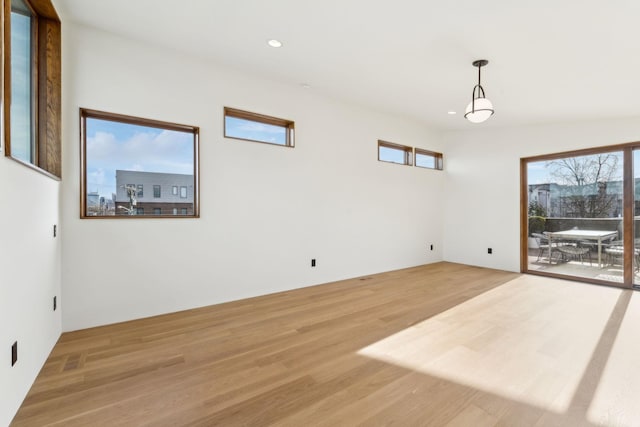 spare room with visible vents, recessed lighting, a wealth of natural light, and light wood-style floors