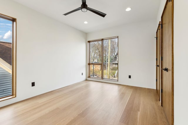 unfurnished bedroom featuring light wood-type flooring, a ceiling fan, and recessed lighting