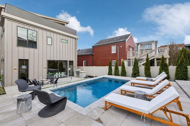 view of swimming pool featuring a patio area, a fenced backyard, and a fenced in pool