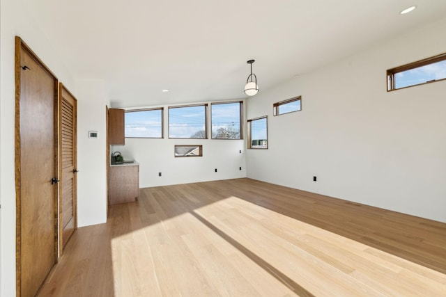 interior space featuring light wood-style flooring and recessed lighting