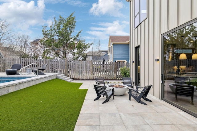 view of yard featuring a fire pit, a patio, fence, and a fenced in pool