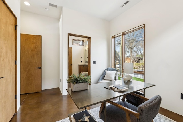 home office with concrete flooring, visible vents, and recessed lighting